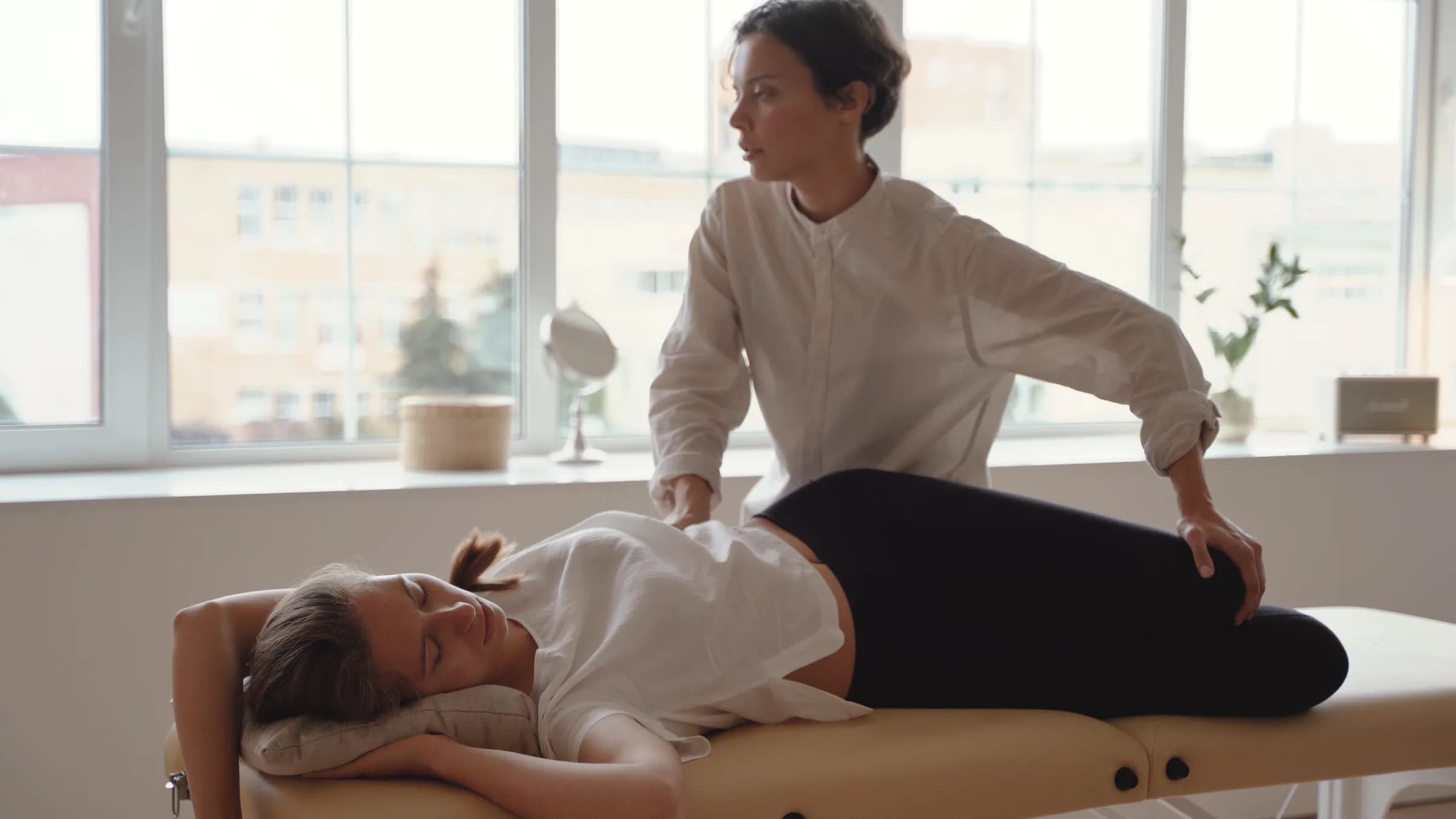 Physiotherapist treating a patient during a home visit in Pune